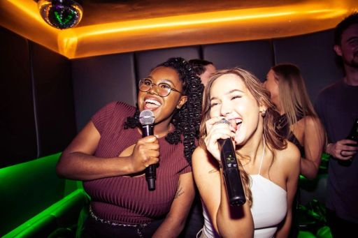 ladies singing karaoke in lucky voice bar